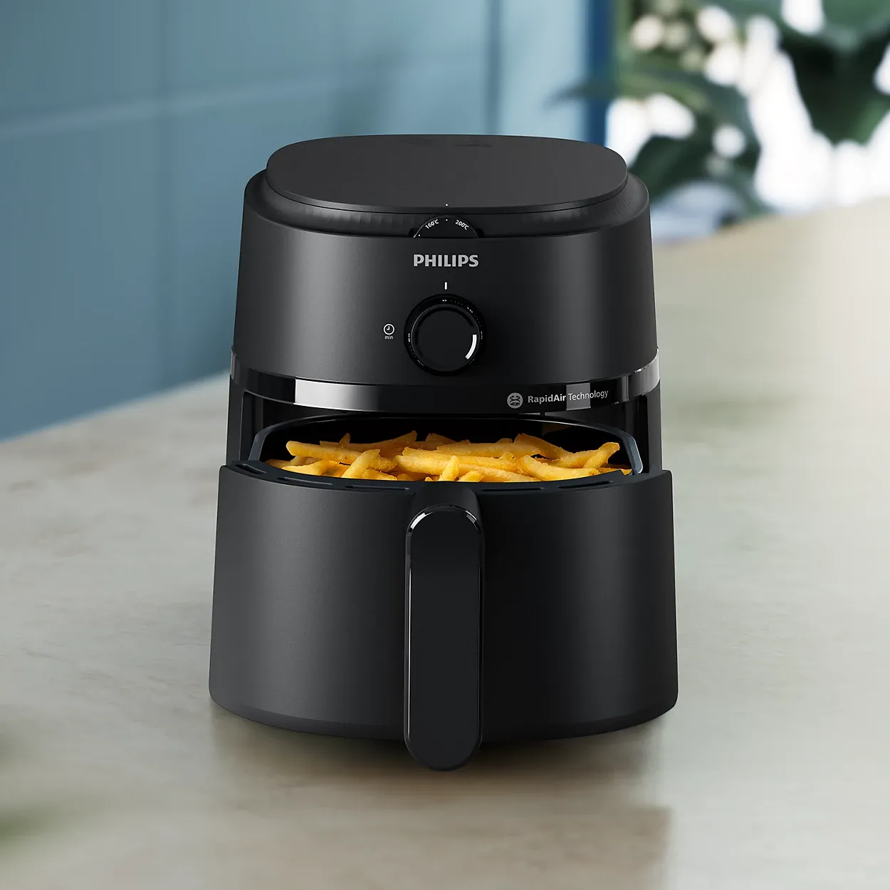 Philips NA110/09 air fryer on a kitchen counter with drawer open